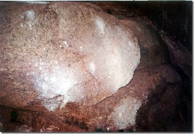 Splashes of Ash on the rocks at the cave